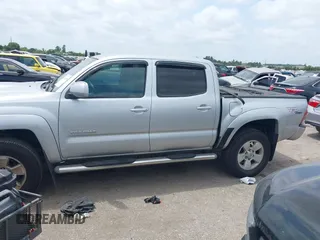 2009 Toyota Tacoma with VIN 3TMLU42N69M032320, listed as a IAAI auction lot 42280196 with 214,720 mi miles and . Bid and sale history available at DreamBid. Image 14.