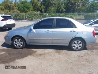2005 Kia Spectra LX with VIN KNAFE121955107403, listed as a IAAI auction lot 42055036 with 157,605 mi miles. Bid and sale history available at carsss.com. Image 14.
