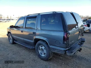 1999 GMC Yukon with VIN 1GKEK13R3XJ750307, listed as a Copart auction lot 84728104 with 212,879 mi miles and Salvage Title. Bid and sale history available at carsss.com. Image 2.