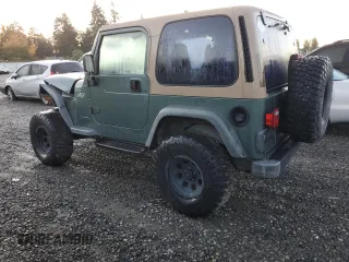 2000 Jeep Wrangler Sport with VIN 1J4FA49S1YP748529, listed as a Copart auction lot 77041924 with 154,949 mi miles and Salvage Title. Bid and sale history available at carsss.com. Image 2.