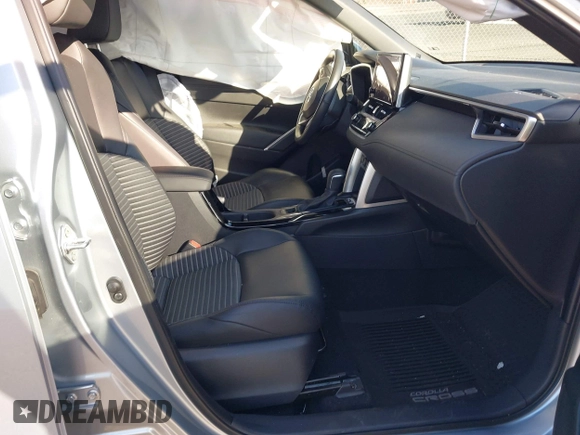 2023 Toyota Corolla Cross Hybrid S with VIN 7MUFBABG7PV003141, listed as a IAAI auction lot 41443111 with 16,297 mi miles and . Bid and sale history available at DreamBid. Image 5.