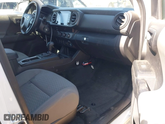 2023 Toyota Tacoma SR with VIN 3TYRX5GN9PT072800, listed as a IAAI auction lot 41622901 with 14,528 mi miles and . Bid and sale history available at DreamBid. Image 5.