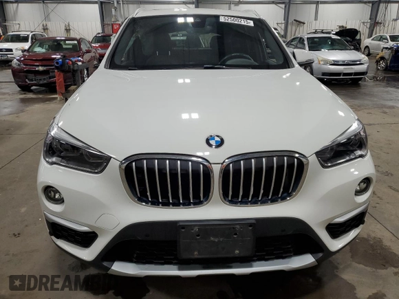 2017 BMW X1 xDrive28i with VIN WBXHT3Z38H4A53824, listed as a Copart auction lot 52500215 with 106,782 mi miles and Salvage title. Bid and sale history available at DreamBid. Image 5.