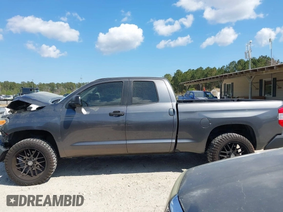 2014 Toyota Tundra 4WD Truck SR with VIN 5TFUM5F11EX055025, listed as a IAAI auction lot 41883017 with 100,565 mi miles. Bid and sale history available at carsss.com. Image 14.