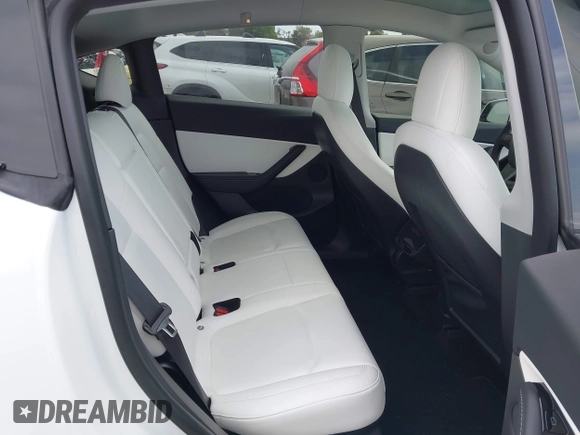 2021 Tesla Model Y Long Range with VIN 5YJYGDEE3MF081304, listed as a IAAI auction lot 42119270 with 90,521 mi miles. Bid and sale history available at carsss.com. Image 8.