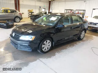 2017 Volkswagen Jetta 1.4T S with VIN 3VW167AJ5HM329706, listed as a IAAI auction lot 40801058 with 144,103 mi miles. Bid and sale history available at carsss.com. Image 2.