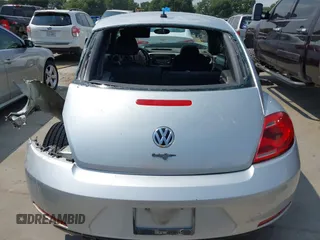 2013 Volkswagen Beetle 2.5L with VIN 3VWJX7AT7DM673319, listed as a IAAI auction lot 42169554 with 128,622 mi miles and . Bid and sale history available at DreamBid. Image 17.