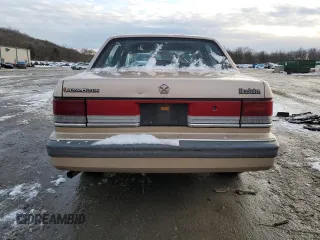1989 Plymouth Acclaim z VIN 1P3BA46K6KF514487, wystawiony jako Copart lot #86534244 z przebiegiem 90 135 mil mil oraz Szkody całkowita. Historia ofert i sprzedaży dostępna na DreamBid. Obrazek 6.