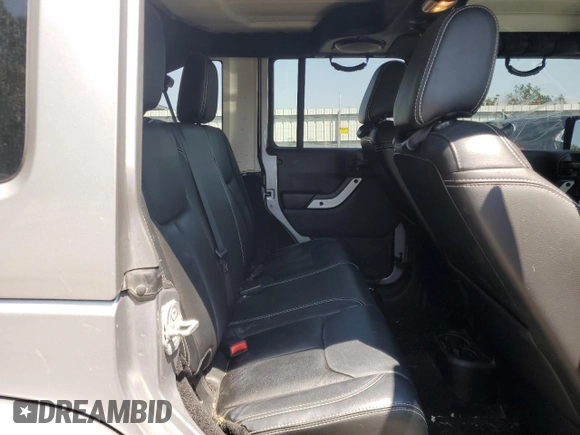 2014 Jeep Wrangler Unlimited Sahara with VIN 1C4BJWEG8EL236951, listed as a Copart auction lot 61046575 with 146,642 mi miles and Salvage title. Bid and sale history available at DreamBid. Image 11.