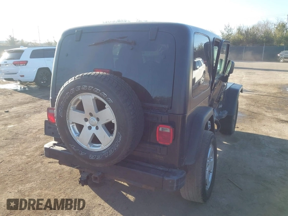 2006 Jeep Wrangler Sport with VIN 1J4FA49SX6P733671, listed as a IAAI auction lot 41779611 with 189,701 mi miles and . Bid and sale history available at carsss.com. Image 4.
