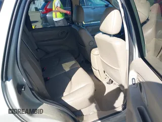 2005 Mazda Tribute S with VIN 4F2CZ96105KM04032, listed as a IAAI auction lot 42157429 with 199,704 mi miles and . Bid and sale history available at carsss.com. Image 8.