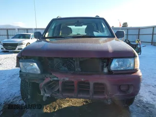 2002 Isuzu Rodeo z VIN 4S2DM58W124319936, wystawiony jako IAAI lot #41555285 z przebiegiem 143 035 mil mil oraz . Historia ofert i sprzedaży dostępna na DreamBid. Obrazek 12.