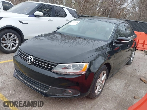 2012 Volkswagen Jetta TDI w/Premium with VIN 3VWLL7AJ9CM367840, listed as a IAAI auction lot 41868444 with 176,486 mi miles and . Bid and sale history available at DreamBid. Image 2.