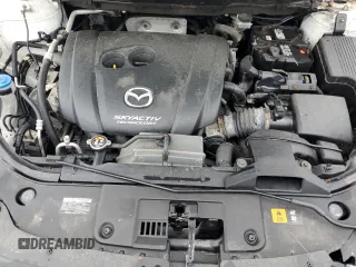 2016 Mazda CX-5 Sport z VIN JM3KE4BY2G0802376, wystawiony jako Copart lot #55976585 z przebiegiem 112 600 mil mil oraz Szkoda całkowita • Salvage title. Historia ofert i sprzedaży dostępna na DreamBid. Obrazek 11.