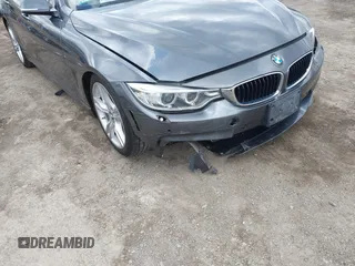 2015 BMW 4 Series 428i xDrive z VIN WBA4A7C5XFD415131, wystawiony jako IAAI lot #42100618 z przebiegiem 89 093 mil mil oraz . Historia ofert i sprzedaży dostępna na DreamBid. Obrazek 6.