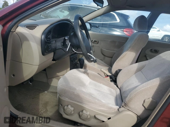 2003 Kia Spectra with VIN KNAFB121935241589, listed as a Copart auction lot 71933194 with 61,738 mi miles and Salvage Title. Bid and sale history available at DreamBid. Image 7.