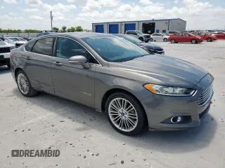 2013 Ford Fusion SE Hybrid with VIN 3FA6P0LU8DR261232, listed as a Copart auction lot 60674105 with 132,901 mi miles and Clean title. Bid and sale history available at DreamBid. Image 4.