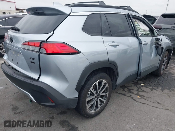 2023 Toyota Corolla Cross XLE with VIN 7MUEAABG8PV077117, listed as a IAAI auction lot 42052305 with 21,571 mi miles and . Bid and sale history available at DreamBid. Image 4.