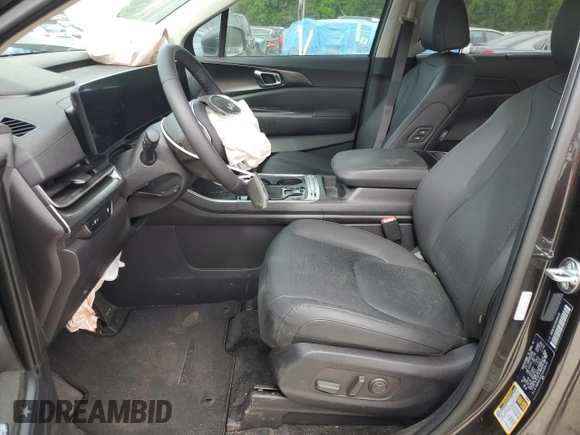2025 Kia Carnival SX with VIN KNDNE5K37S6490478, listed as a Copart auction lot 51389565 with 6,929 mi miles and Salvage Title. Bid and sale history available at DreamBid. Image 7.