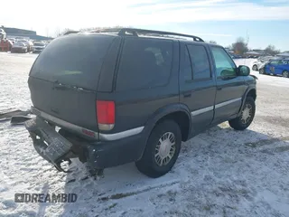 1999 GMC Jimmy SLE with VIN 1GKDT13W5X2520020, listed as a IAAI auction lot 41337936 with 277,615 mi miles. Bid and sale history available at carsss.com. Image 4.