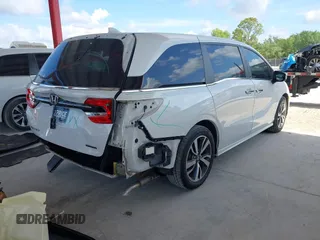 2021 Honda Odyssey Touring z VIN 5FNRL6H80MB003323, wystawiony jako IAAI lot #42303968 z przebiegiem 51 531 mil mil oraz . Historia ofert i sprzedaży dostępna na DreamBid. Obrazek 4.
