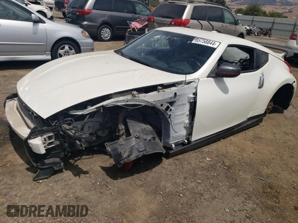 2014 Nissan 370Z with VIN JN1AZ4EH2EM631397, listed as a Copart auction lot 65758844 with 0 mi miles and Salvage Title. Bid and sale history available at carsss.com. Image 1.