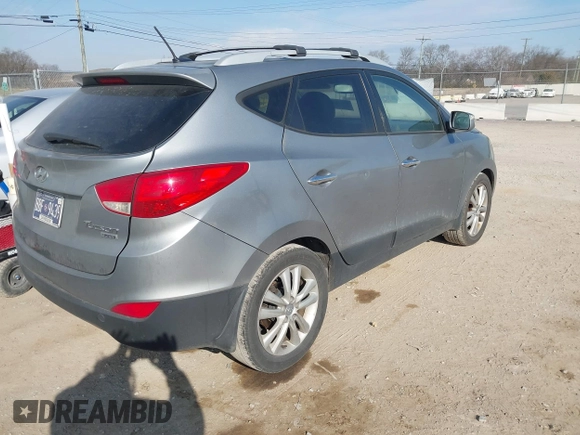 2013 Hyundai Tucson GLS with VIN KM8JU3AC0DU572232, listed as a IAAI auction lot 41724332 with 232,661 mi miles. Bid and sale history available at carsss.com. Image 4.