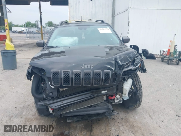 2021 Jeep Cherokee Trailhawk with VIN 1C4PJMBX0MD167941, listed as a IAAI auction lot 42507379 with 70,414 mi miles and . Bid and sale history available at DreamBid. Image 13.