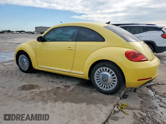 2014 Volkswagen Beetle 2.5L with VIN 3VWJX7AT2EM610372, listed as a Copart auction lot 60163345 with 121,497 mi miles and Salvage title. Bid and sale history available at DreamBid. Image 2.