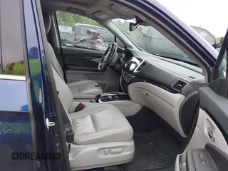 2017 Honda Pilot Touring with VIN 5FNYF6H99HB093136, listed as a IAAI auction lot 42507326 with 125,579 mi miles and . Bid and sale history available at DreamBid. Image 5.