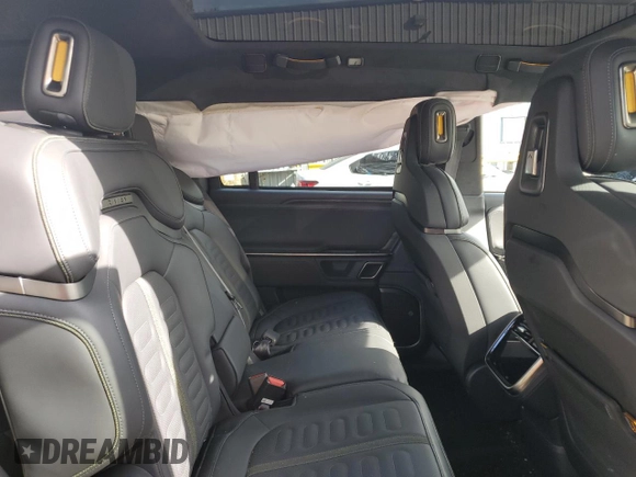 2024 Rivian R1S Adventure z VIN 7PDSGABAXRN035766, wystawiony jako Copart lot #77481034 z przebiegiem 6 590 mil mil oraz Szkoda całkowita • Salvage title. Historia ofert i sprzedaży dostępna na DreamBid. Obrazek 12.