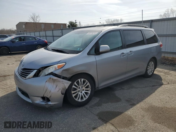 2012 Toyota Sienna XLE AAS with VIN 5TDYK3DCXCS235414, listed as a Copart auction lot 48776245 with 149,658 mi miles and Salvage Title. Bid and sale history available at carsss.com. Image 1.