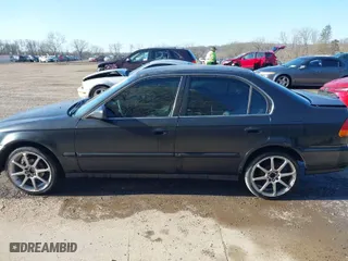 1997 Honda Civic LX with VIN 2HGEJ6670VH567081, listed as a IAAI auction lot 41995007 with 107,943 mi miles. Bid and sale history available at carsss.com. Image 14.