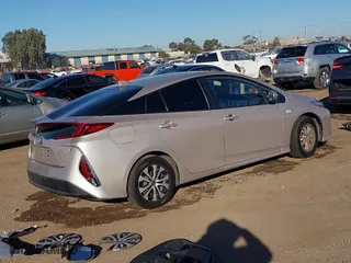 2021 Toyota Prius Prime LE with VIN JTDKAMFP1M3178179, listed as a IAAI auction lot 41233411 with 83,035 mi miles. Bid and sale history available at carsss.com. Image 4.