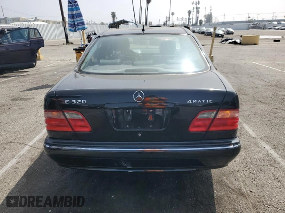 2002 Mercedes-Benz E-Class with VIN WDBJF82JX2X064384, listed as a Copart auction lot 53058325 with 188,440 mi miles and Salvage Title. Bid and sale history available at carsss.com. Image 6.