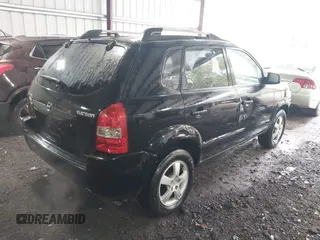 2005 Hyundai Tucson GL with VIN KM8JM12B75U072080, listed as a IAAI auction lot 41779464 with 191,771 mi miles. Bid and sale history available at carsss.com. Image 4.