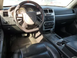 2010 Dodge Charger SXT with VIN 2B3CA3CV5AH233504, listed as a Copart auction lot 51800395 with 253,535 mi miles and Salvage Title. Bid and sale history available at carsss.com. Image 8.