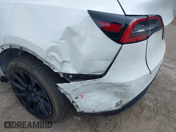 2022 Tesla Model Y Long Range z VIN 7SAYGDEE7NF385207, wystawiony jako IAAI lot #42054449 z przebiegiem 52 834 mil mil oraz . Historia ofert i sprzedaży dostępna na DreamBid. Obrazek 6.