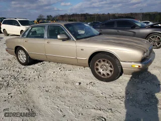 1998 Jaguar XJ with VIN SAJHX1242WC845736, listed as a Copart auction lot 82006044 with 188,785 mi miles and Salvage Title. Bid and sale history available at carsss.com. Image 4.