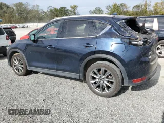 2021 Mazda CX-5 Signature with VIN JM3KFBEY3M0439658, listed as a Copart auction lot 74534464 with 50,816 mi miles and Salvage Title. Bid and sale history available at carsss.com. Image 2.