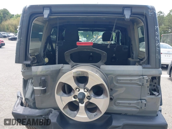 2020 Jeep Wrangler Unlimited Black and Tan with VIN 1C4HJXDG3LW298223, listed as a IAAI auction lot 42446032 with 17,688 mi miles and . Bid and sale history available at DreamBid. Image 16.