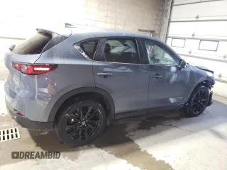2024 Mazda CX-5 S Carbon Edition z VIN JM3KFBCL2R0528359, wystawiony jako Copart lot #58007515 z przebiegiem 20 743 mil mil oraz Tytuł czysty. Historia ofert i sprzedaży dostępna na DreamBid. Obrazek 3.