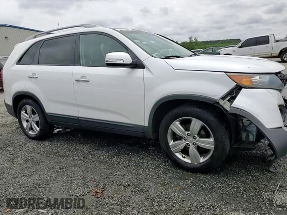 2012 Kia Sorento EX z VIN 5XYKU4A20CG301970, wystawiony jako Copart lot #54360795 z przebiegiem 208 616 mil mil oraz Szkoda całkowita • Salvage title. Historia ofert i sprzedaży dostępna na DreamBid. Obrazek 14.