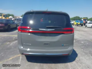 2021 Chrysler Pacifica Hybrid Touring L with VIN 2C4RC1L7XMR586201, listed as a IAAI auction lot 41859340 with 55,906 mi miles. Bid and sale history available at carsss.com. Image 16.