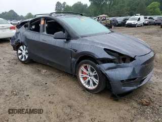 2023 Tesla Model Y Long Range z VIN 7SAYGDEE7PF870370, wystawiony jako Copart lot #55700135 z przebiegiem 32 410 mil mil oraz Szkoda całkowita • Salvage title. Historia ofert i sprzedaży dostępna na DreamBid. Obrazek 4.