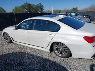 2017 BMW 7 Series 750i with VIN WBA7F0C34HGM21738, listed as a IAAI auction lot 41772933 with 62,923 mi miles and . Bid and sale history available at carsss.com. Image 14.
