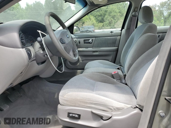 2002 Ford Taurus SES Standard with VIN 1FAFP55U42A184084, listed as a Copart auction lot 59822495 with 124,835 mi miles and Salvage title. Bid and sale history available at DreamBid. Image 7.