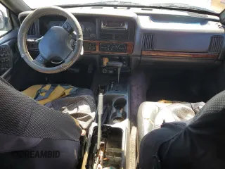 1996 Jeep Grand Cherokee Laredo with VIN 1J4FX58S1TC169501, listed as a Copart auction lot 59143174 with 0 mi miles and Salvage Title. Bid and sale history available at carsss.com. Image 8.