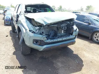 2023 Toyota Tacoma SR with VIN 3TMCZ5AN1PM581266, listed as a IAAI auction lot 42371395 with 32,582 mi miles and . Bid and sale history available at DreamBid. Image 6.
