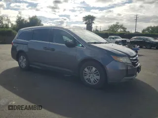 2015 Honda Odyssey LX with VIN 5FNRL5H27FB018491, listed as a Copart auction lot 54888445 with 129,488 mi miles and Salvage Title. Bid and sale history available at DreamBid. Image 4.